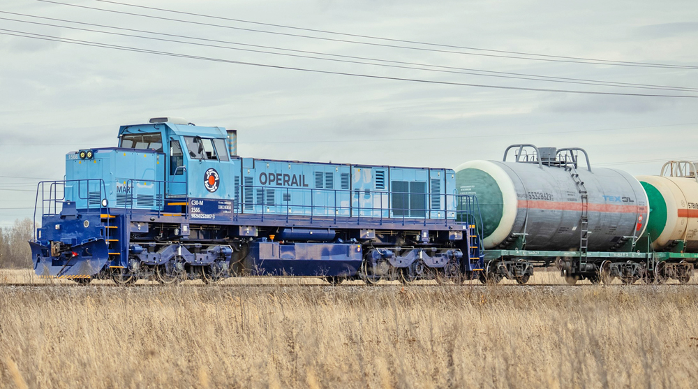 Blue locomotive with low-profile hood and angled cab