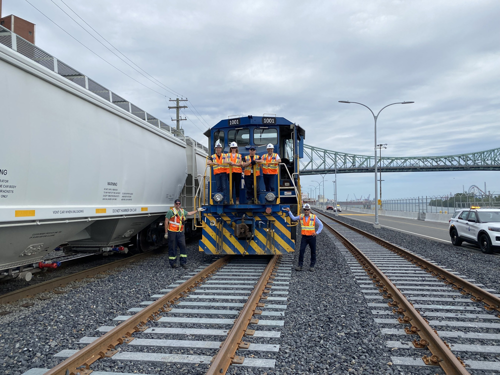Locomotive posed on new track with concrete ties