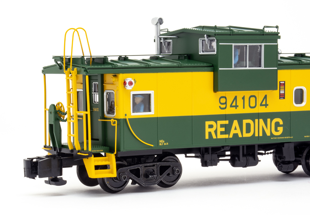 Color photo showing side view of S gauge caboose.