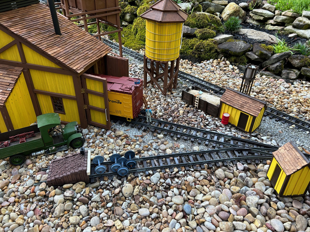 yellow and brown structures on garden railway