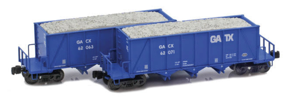 A set of two model freight cars in a blue paint scheme