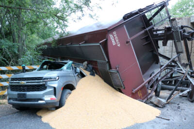 Derailed car from BNSF grain train hits crew transport vehicle