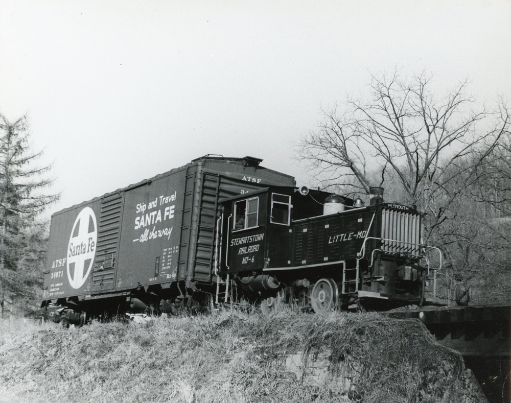 Small diesel with a single boxcar