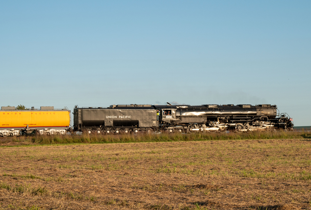 black steam train on prairie