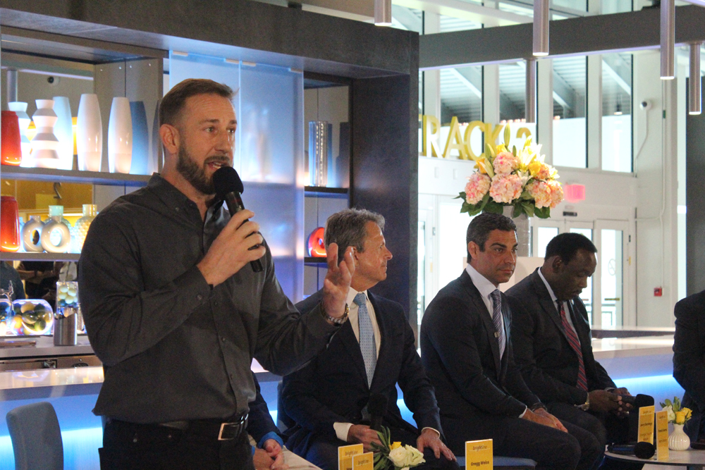 man speaking around other men