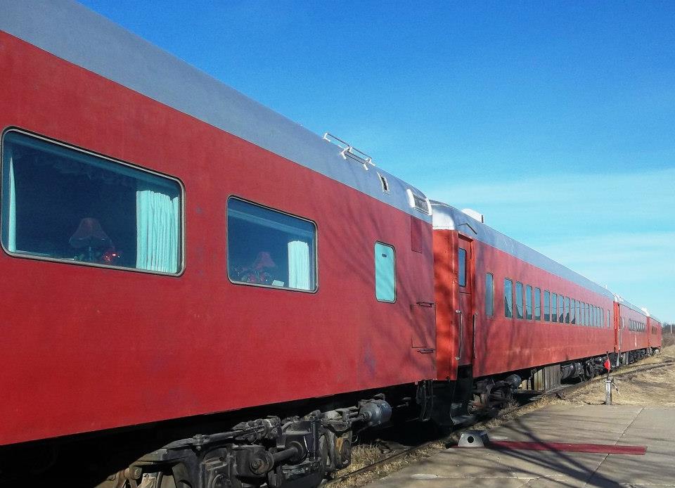 Red-colored passenger cars outside a clear day
