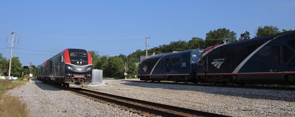 Two long distance passenger trains meet
