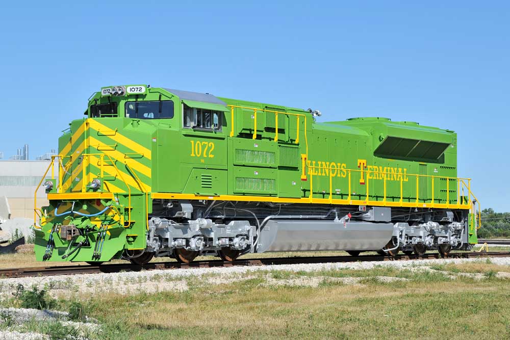 Green-and-yellow modern locomotive painted like historic Illinois Terminal locomotives
