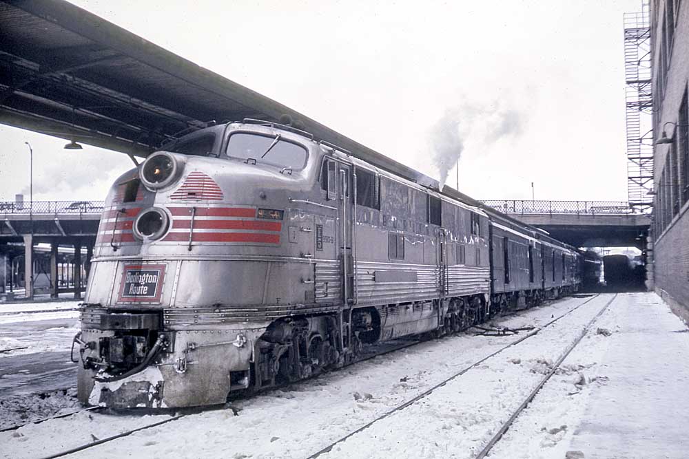 Streamlined Burlington Route diesel locomotives in station with passenger train