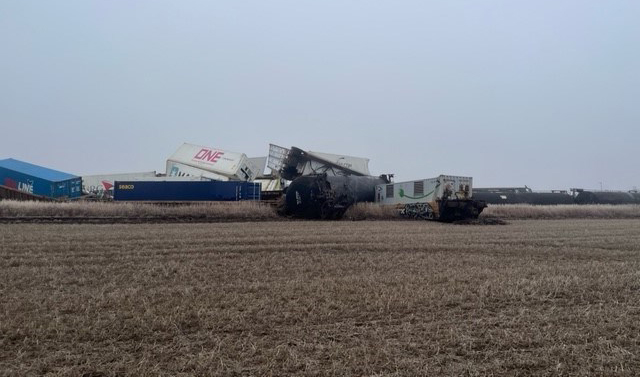 Derailed cars in field