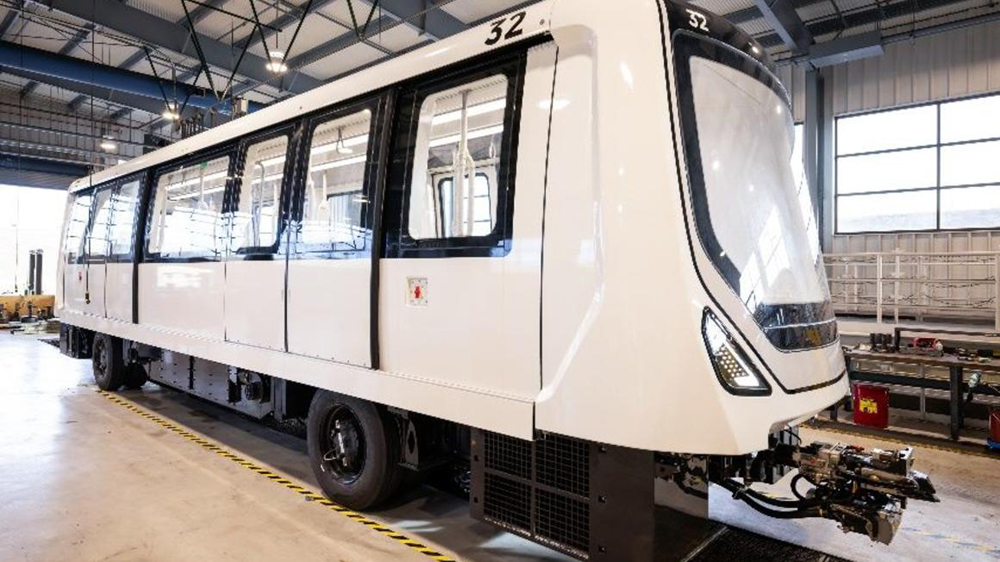 White airport peoplemover with rubber tires