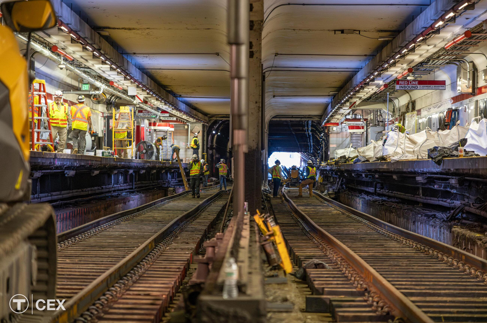 Subway station with crews working on track and platform
