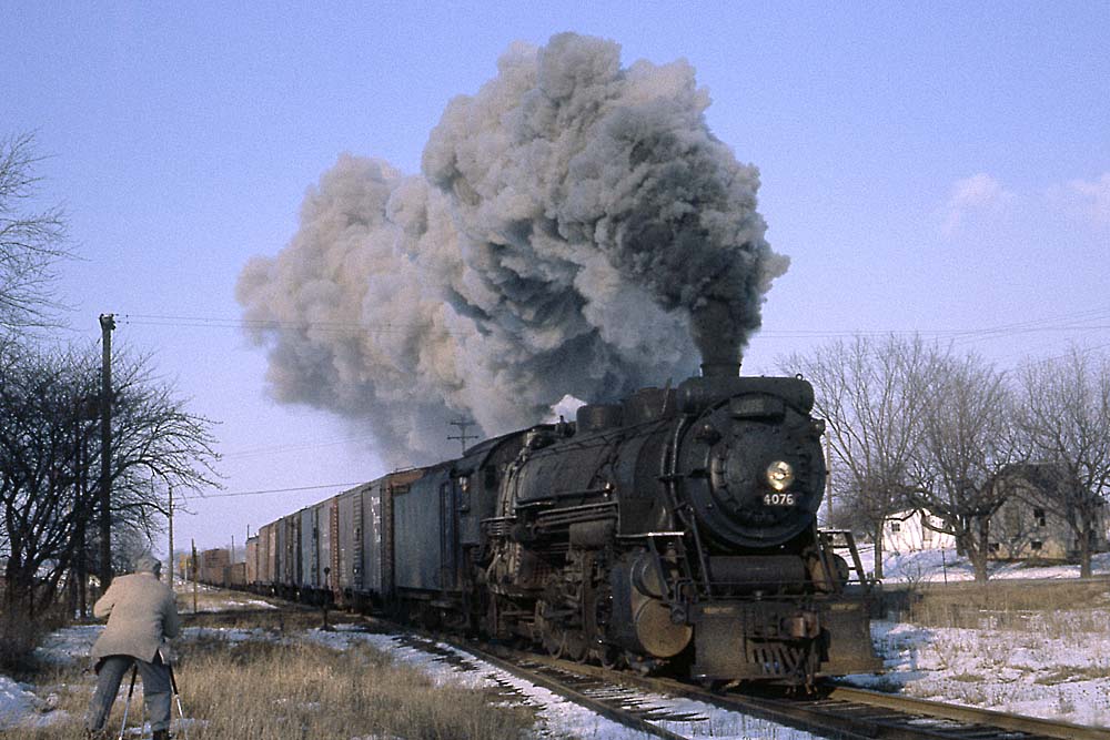 Smoking Grand Trunk Western steam locomotive in snow