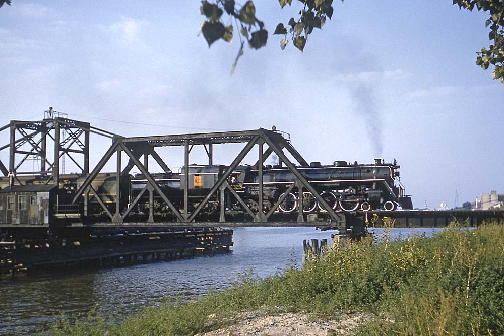 Grand Trunk Western steam locomotive with train on bridge