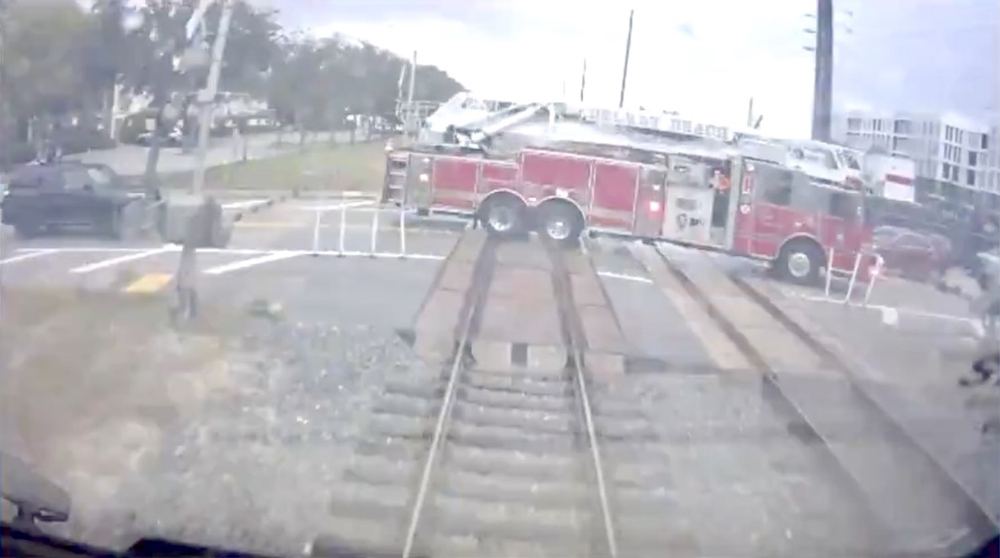 Image of fire truck on grade crossing from locomotive