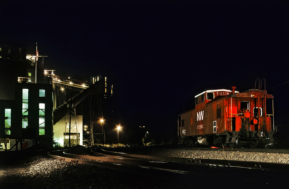 Night photo of caboose at coal loader