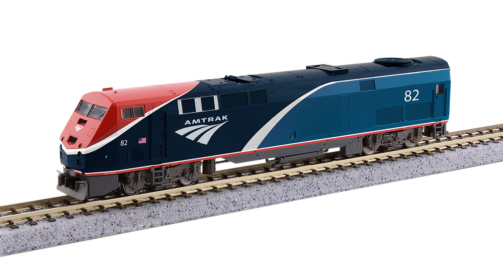 A blue, red and white model locomotive on model rail track
