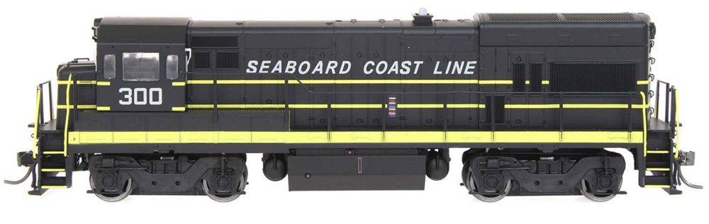 A black model locomotive with yellow detailing and white text