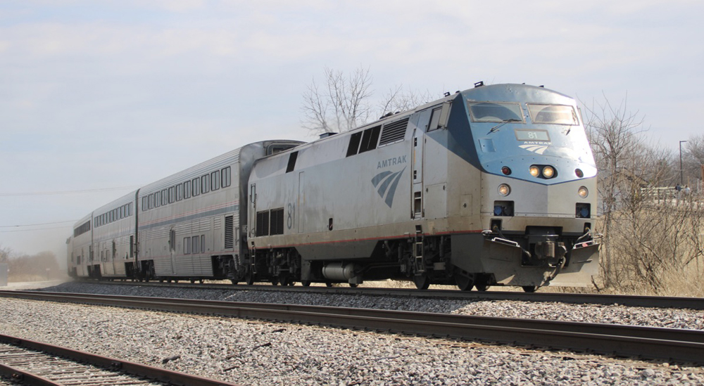 Pasenger train with two locomotives and three bilevel cars