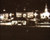 Black and white image on toy train layout of night scene