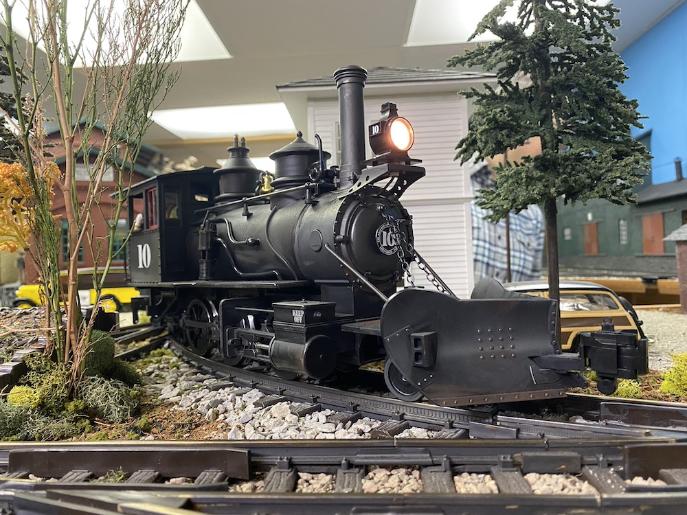 Steam locomotive rounds a curve