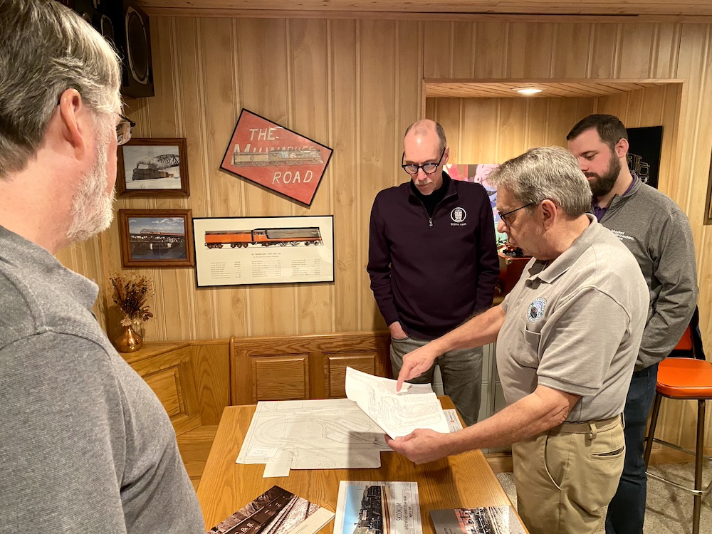 People looking over plans and schematics