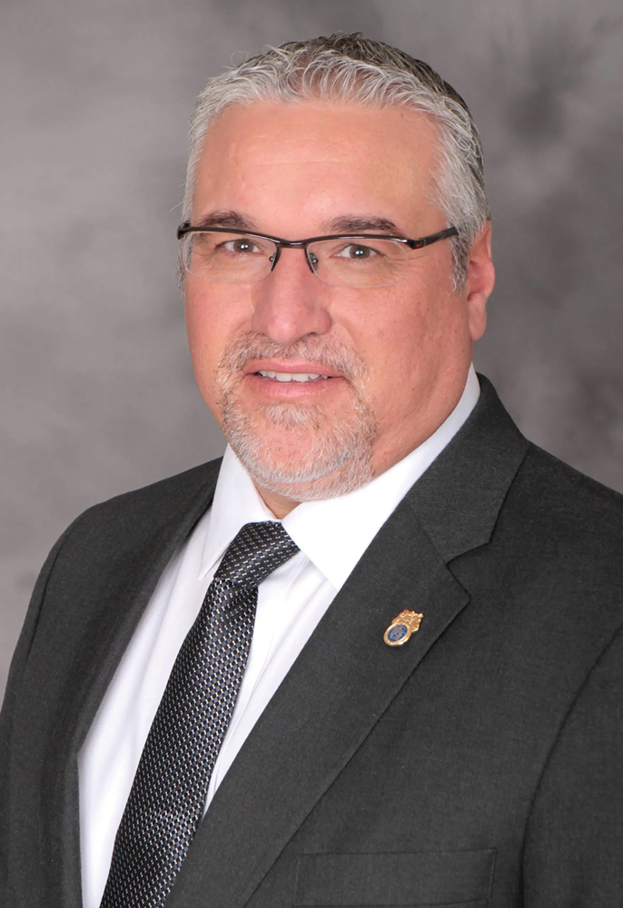Head and shoulder shot of man in suit