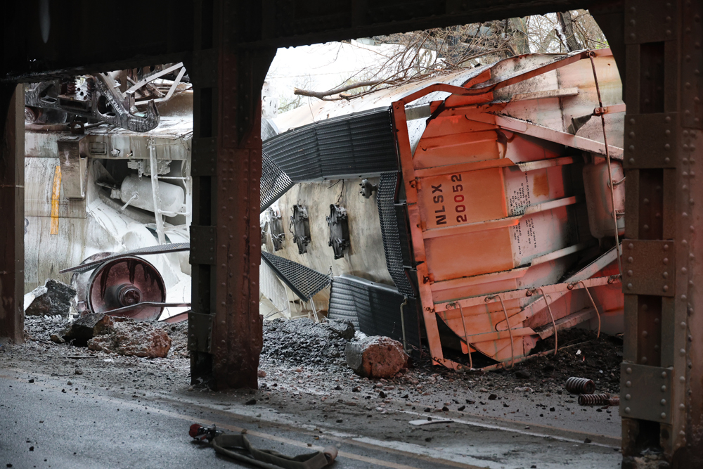 Derailed freight cars as viewed from under bridge