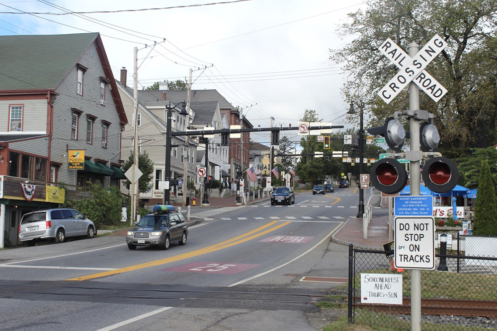Grade crossing with small-town business district in background