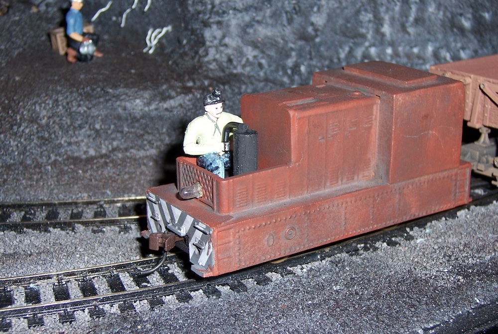 : figure in model train engine