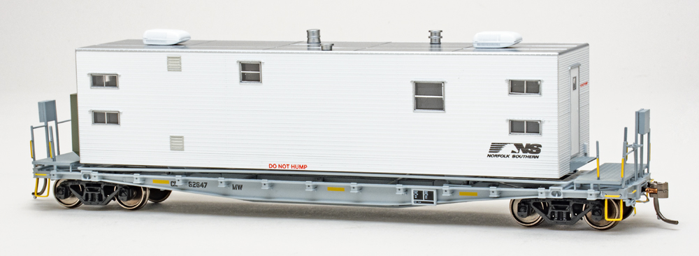 Color photo of HO scale flatcar painted gray with white-and-silver van