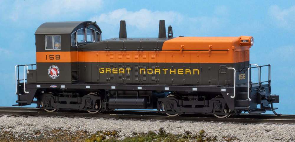 Color photo of HO scale end-cab switcher on scenic base
