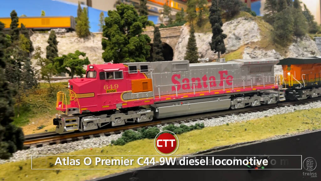 red and silver model locomotive on train layout