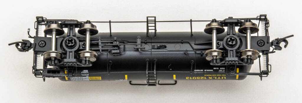 Color photo showing underbody of N scale tank car painted black.