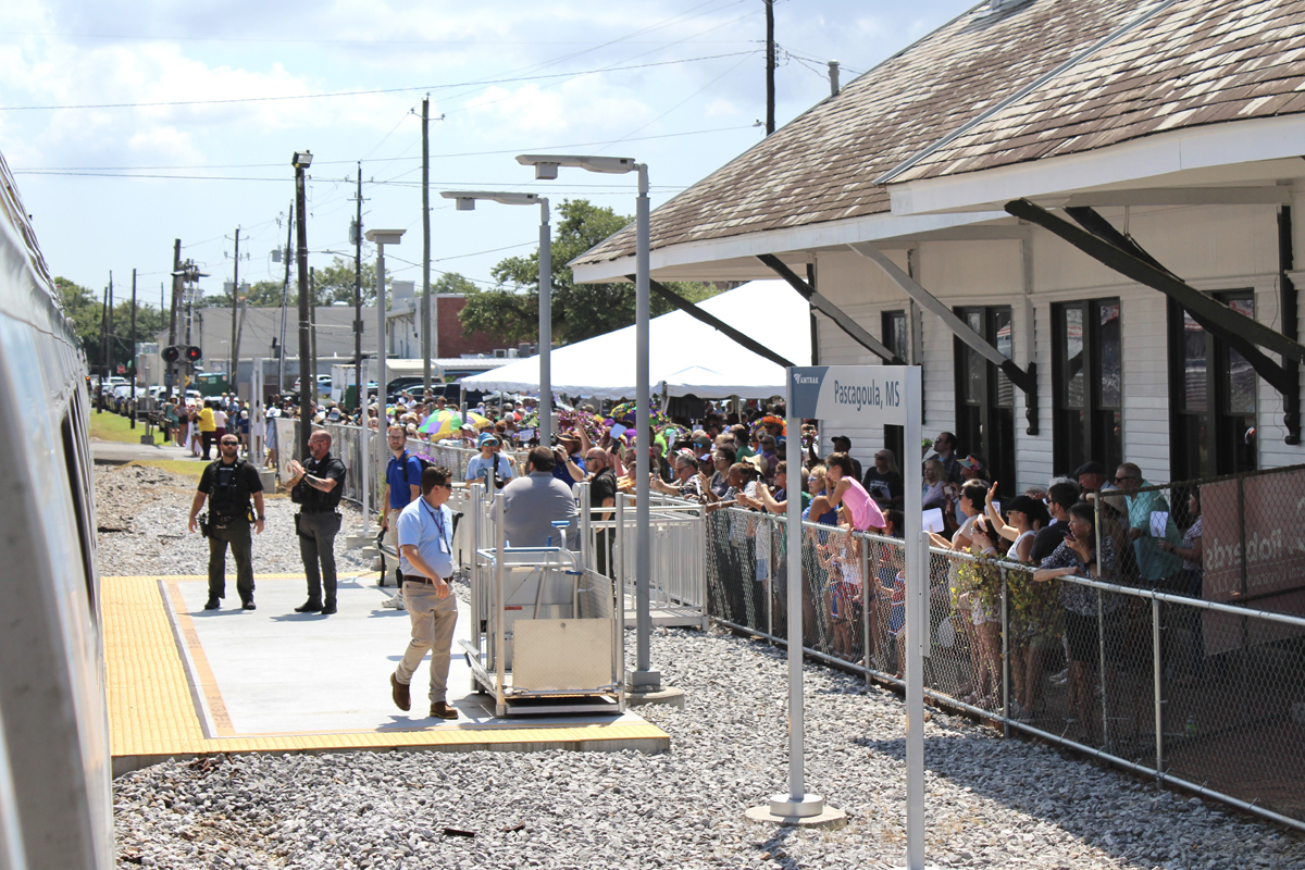 Train stops at station with tiny rectangular concrete platform. Aug. 16, 2025