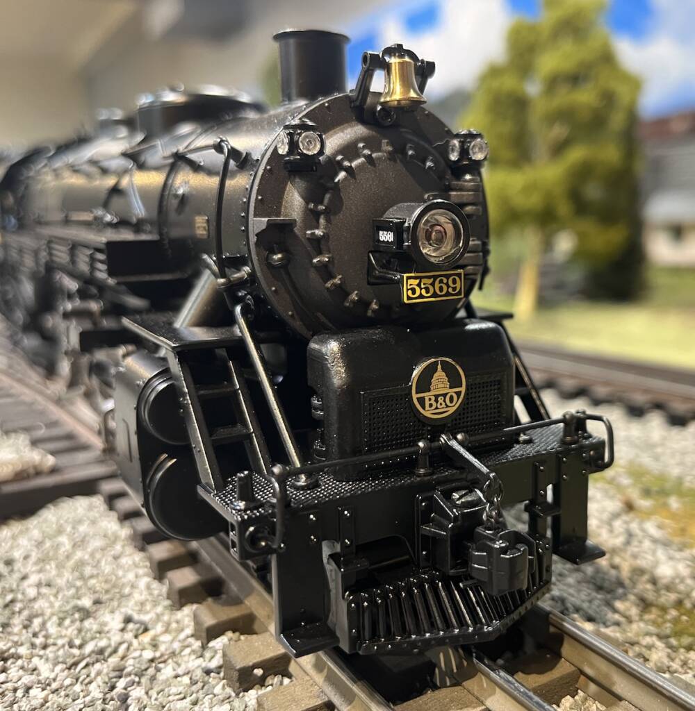 front of black model steam locomotive