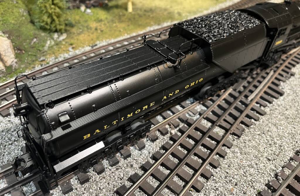 tender of black model steam locomotive