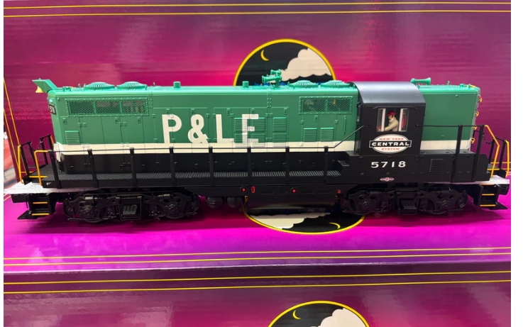 green and white model locomotive