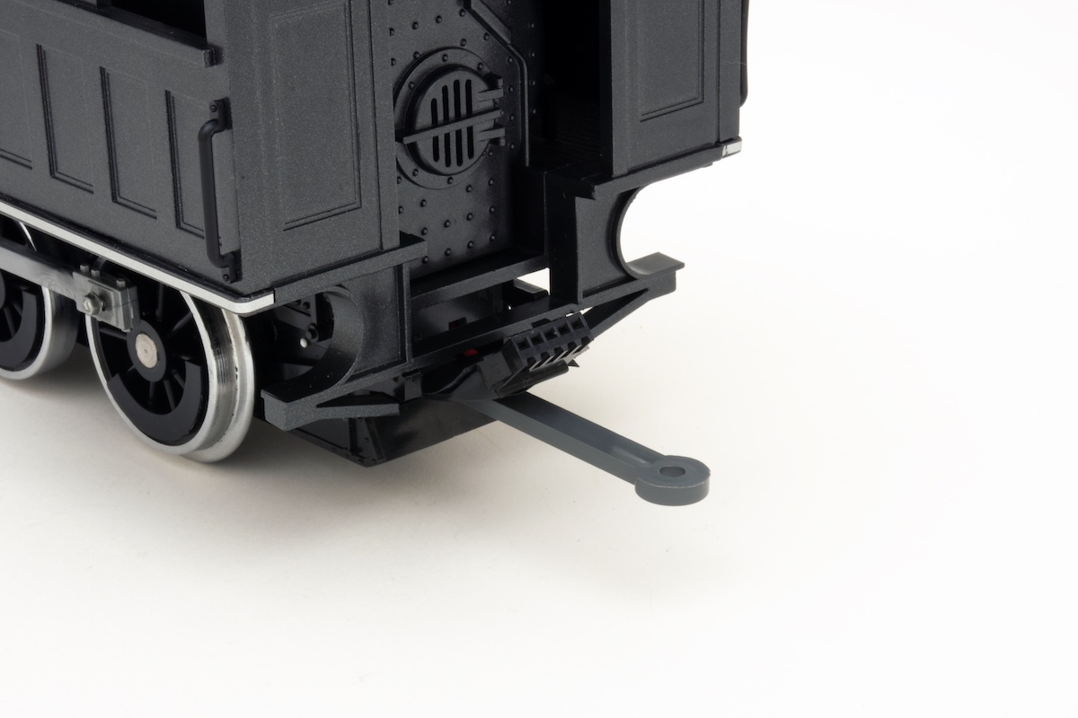 Backs side of large scale steam locomotive with plug