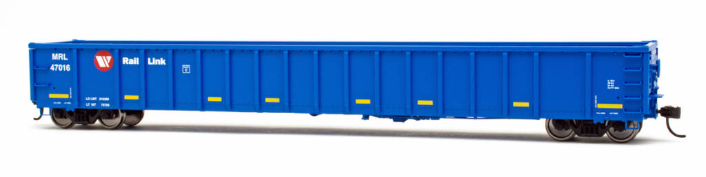 Color photo of HO scale modern gondola painted blue with red, white, and yellow graphics on white background