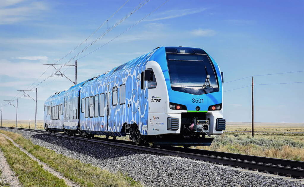 Blue and white multiple-unit passenger train
