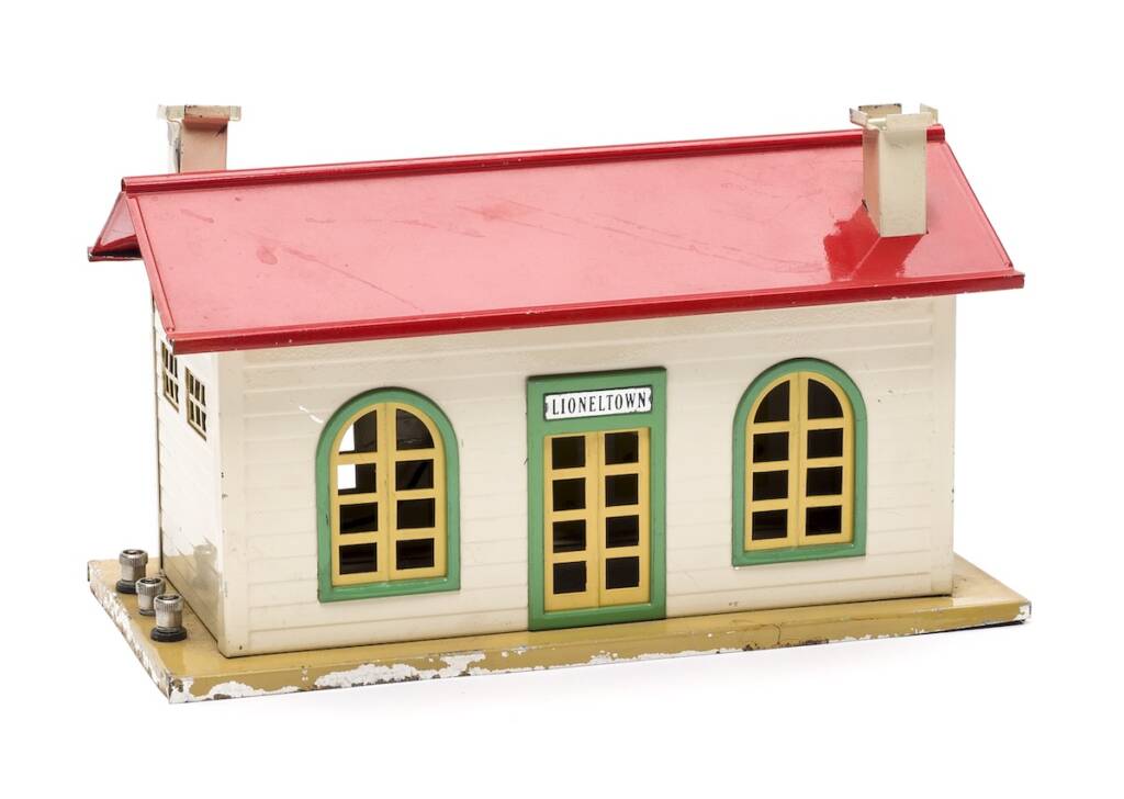 cream and red tin model statio