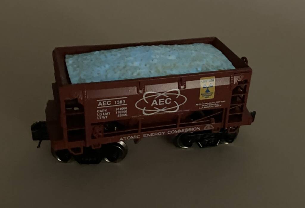 glowing model ore car in low light