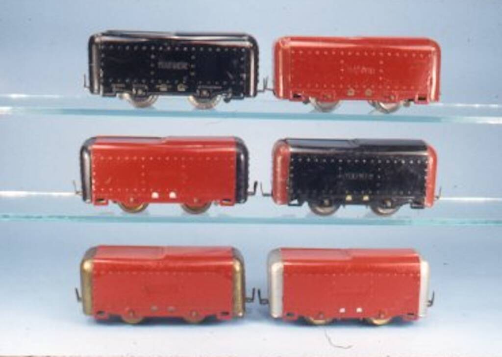 six red and black model tenders