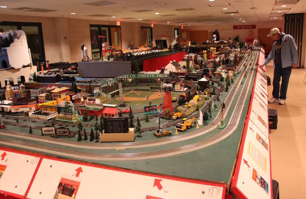 large layout with man pushing button