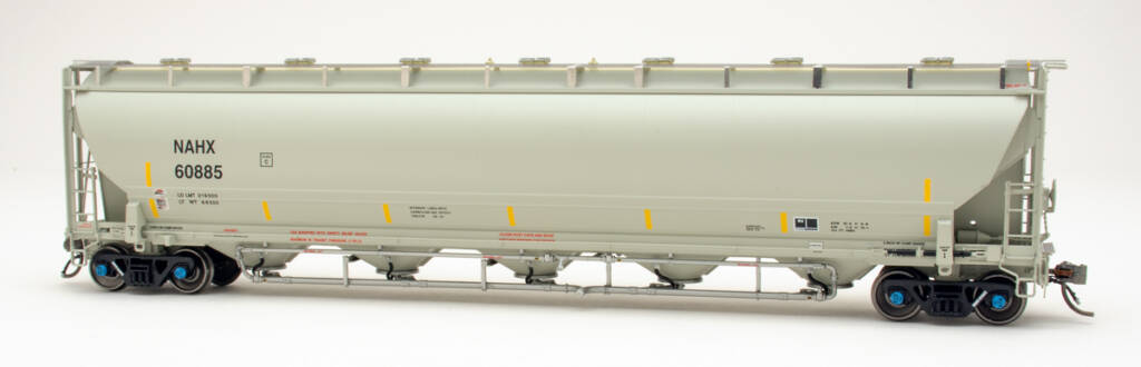 Color photo of HO scale pressure differential covered hopper painted gray with black lettering; red, yellow, white, and black graphics; and black trucks with blue bearing caps on white background. 