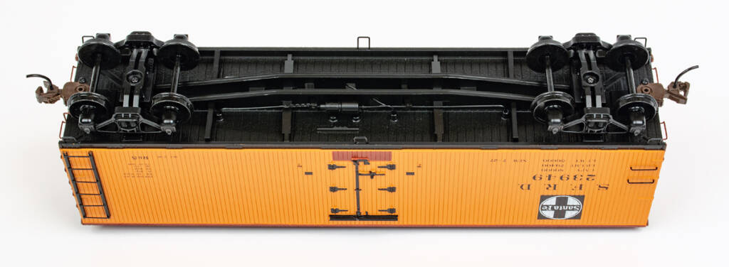 Color photo showing underbody, trucks, and couplers on S scale wood refrigerator car. 