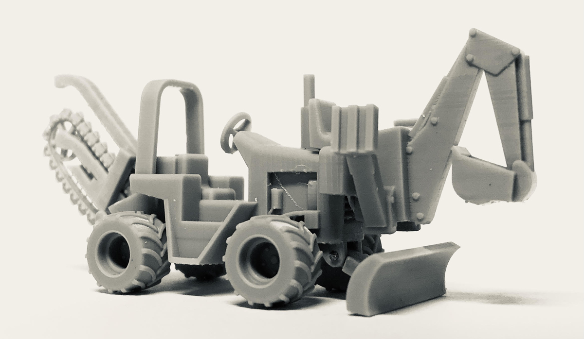 A gray model trencher vehicles