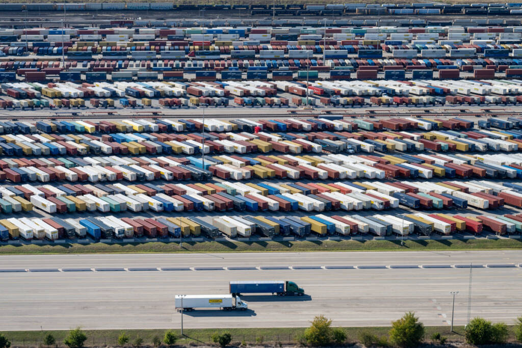 Aerial view of trucks, containers, and intermodal terminal