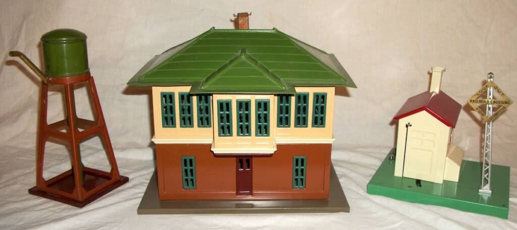 three vintage toy train accessories